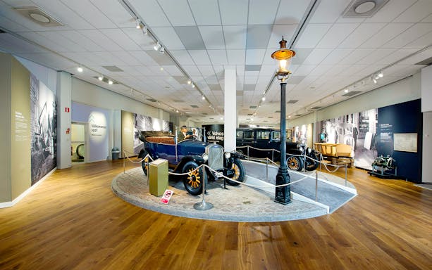 Volvo Museum exhibit with vintage cars in Gothenburg, part of Go City All-Inclusive Pass.