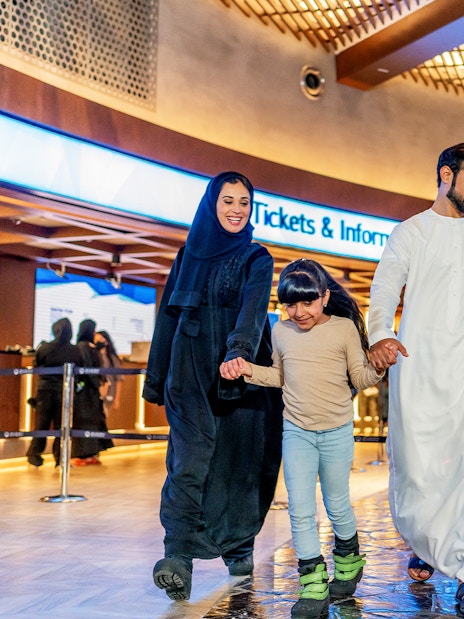 Family enjoying time at Ski Dubai Snow Park entrance.