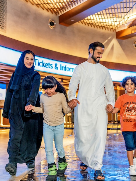 Family enjoying time at Ski Dubai Snow Park entrance.
