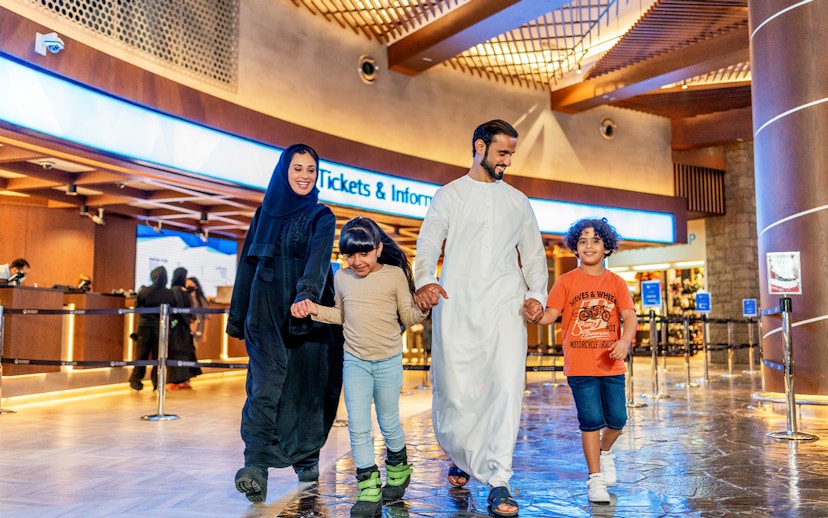 Family enjoying time at Ski Dubai Snow Park entrance.