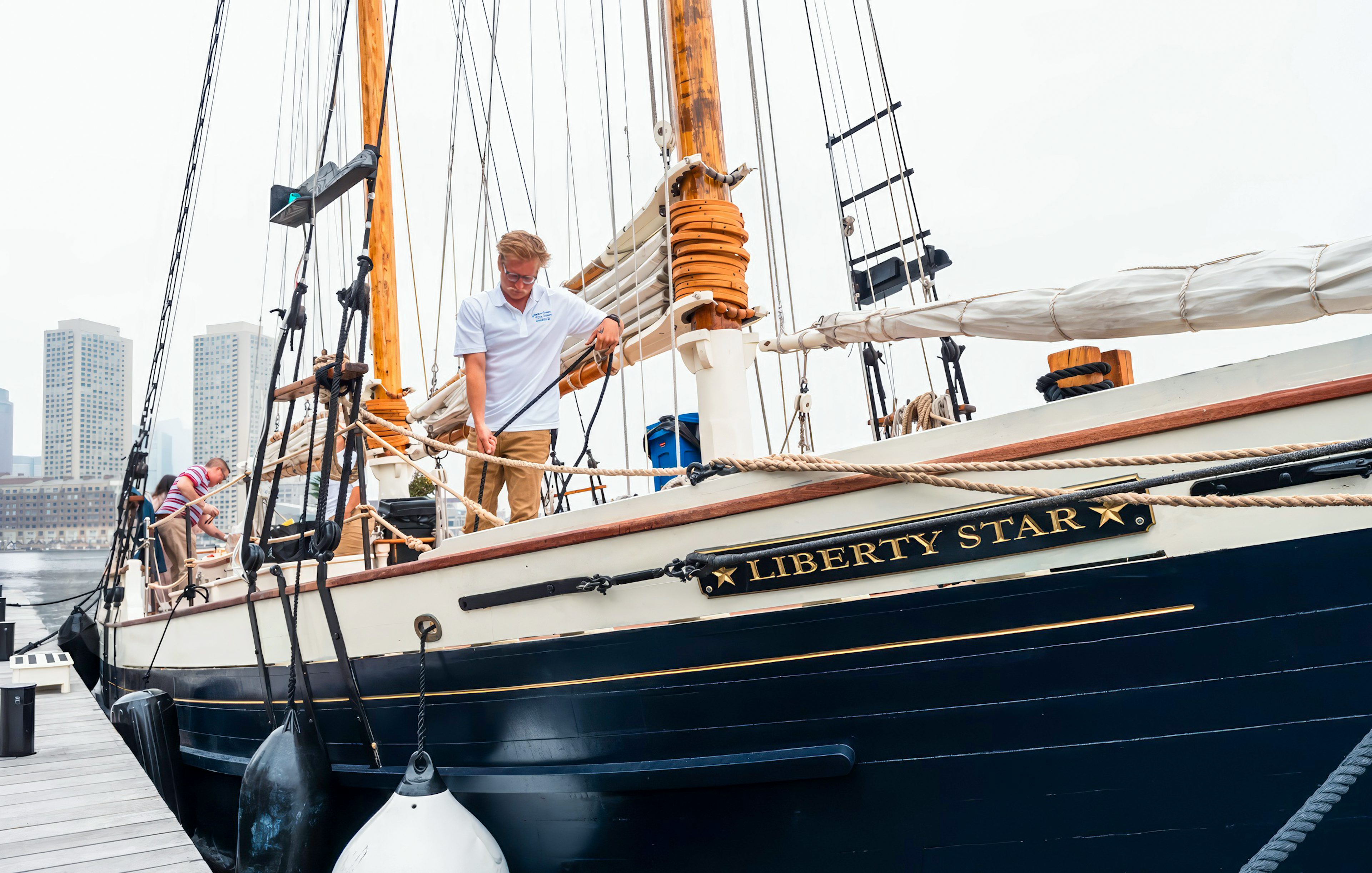 Liberty Star docked at Boston Harbor with crew preparing the ship.