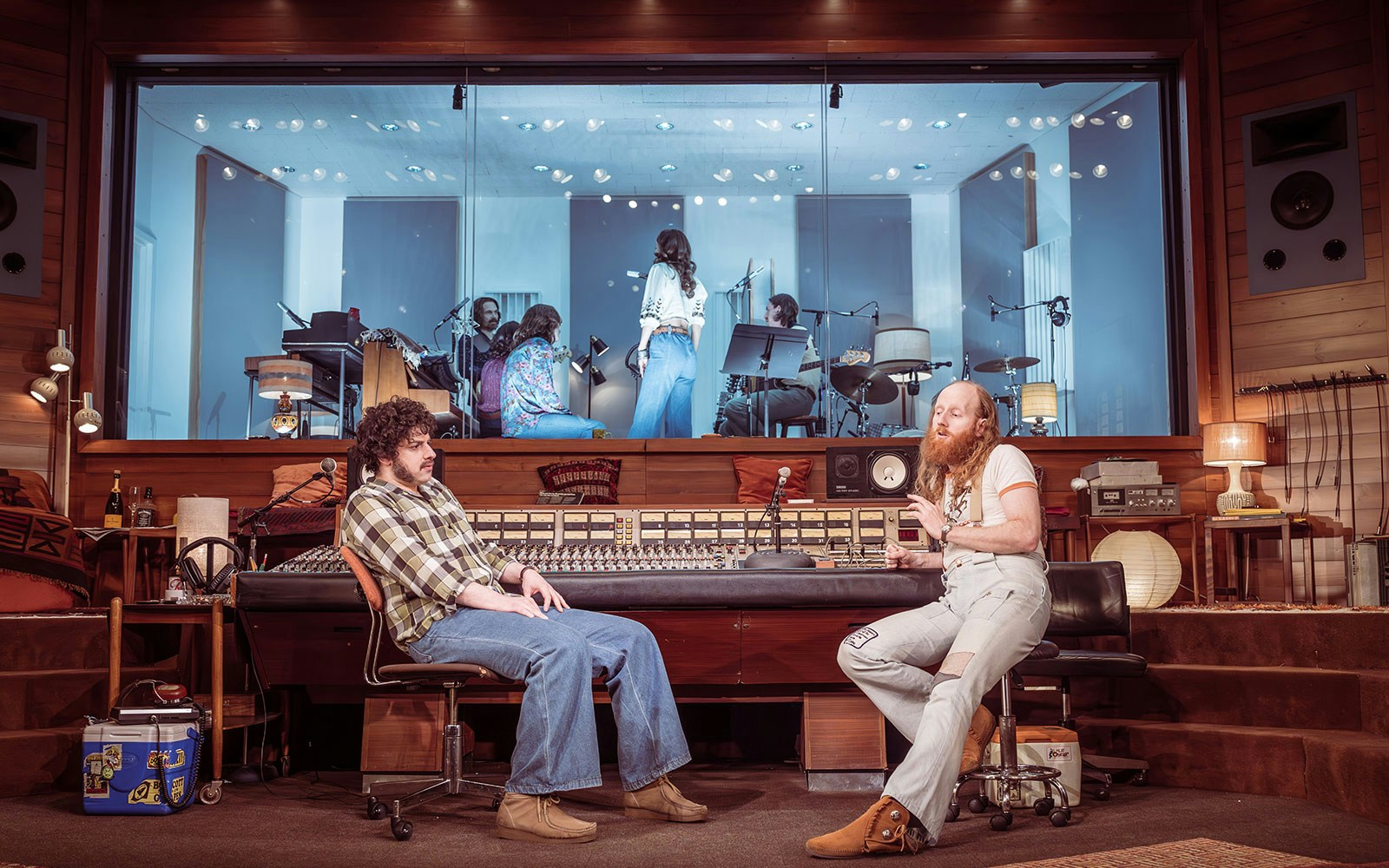 Recording studio with musicians and sound engineers working on a stereophonic project.