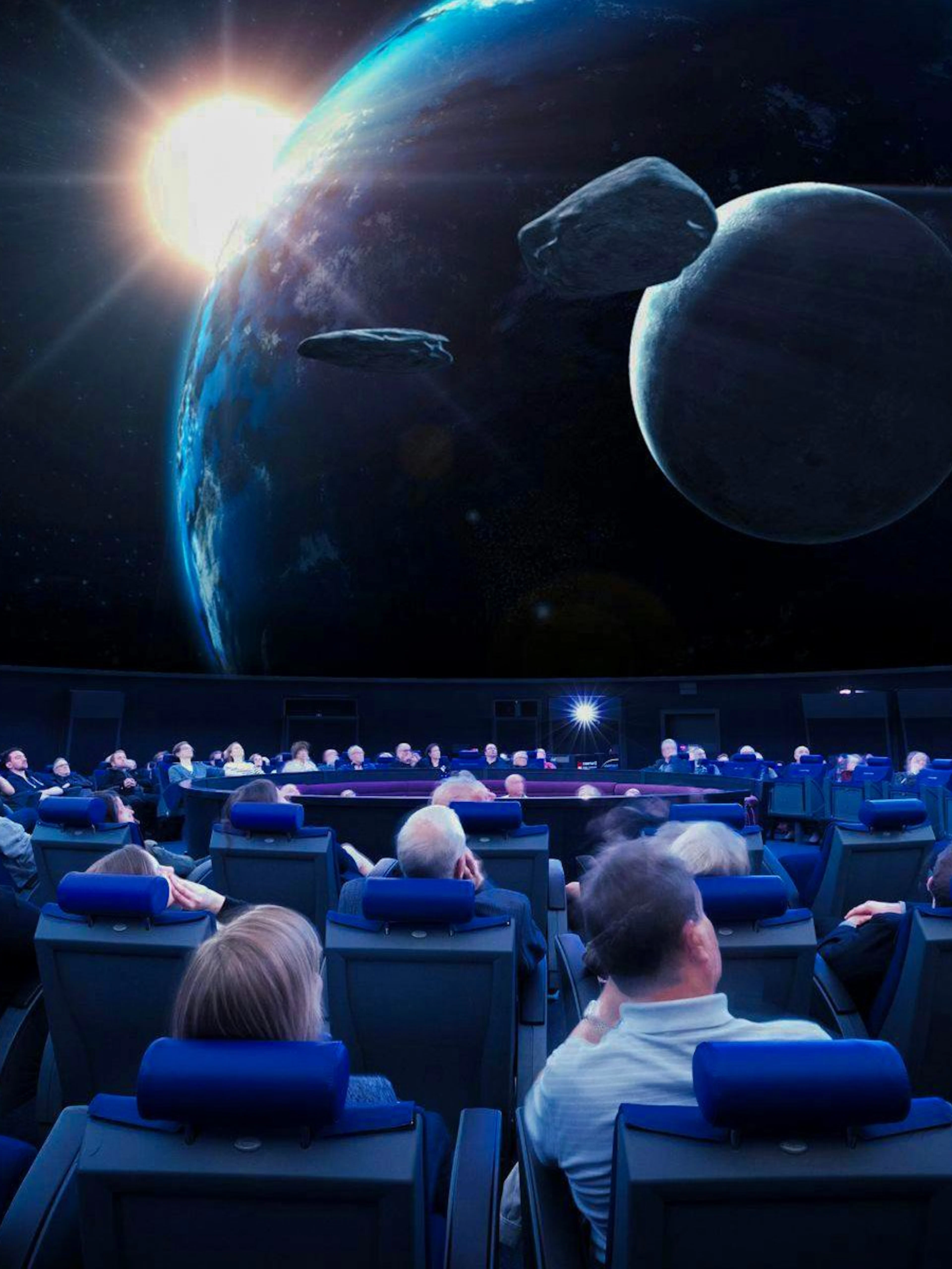 Guests watching a space presentation at the Planetarium Museum of Transport in Lucerne.