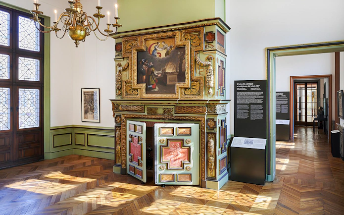 Carnavalet Museum ornate fireplace and exhibition room in Paris.