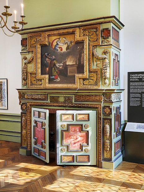 Carnavalet Museum ornate fireplace and exhibition room in Paris.