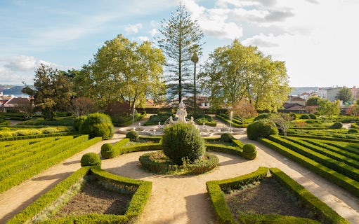 Formal garden with fountain at National Palace of Ajuda, Lisbon.