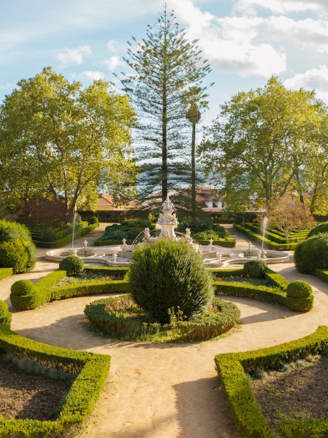 Formal garden with fountain at National Palace of Ajuda, Lisbon.