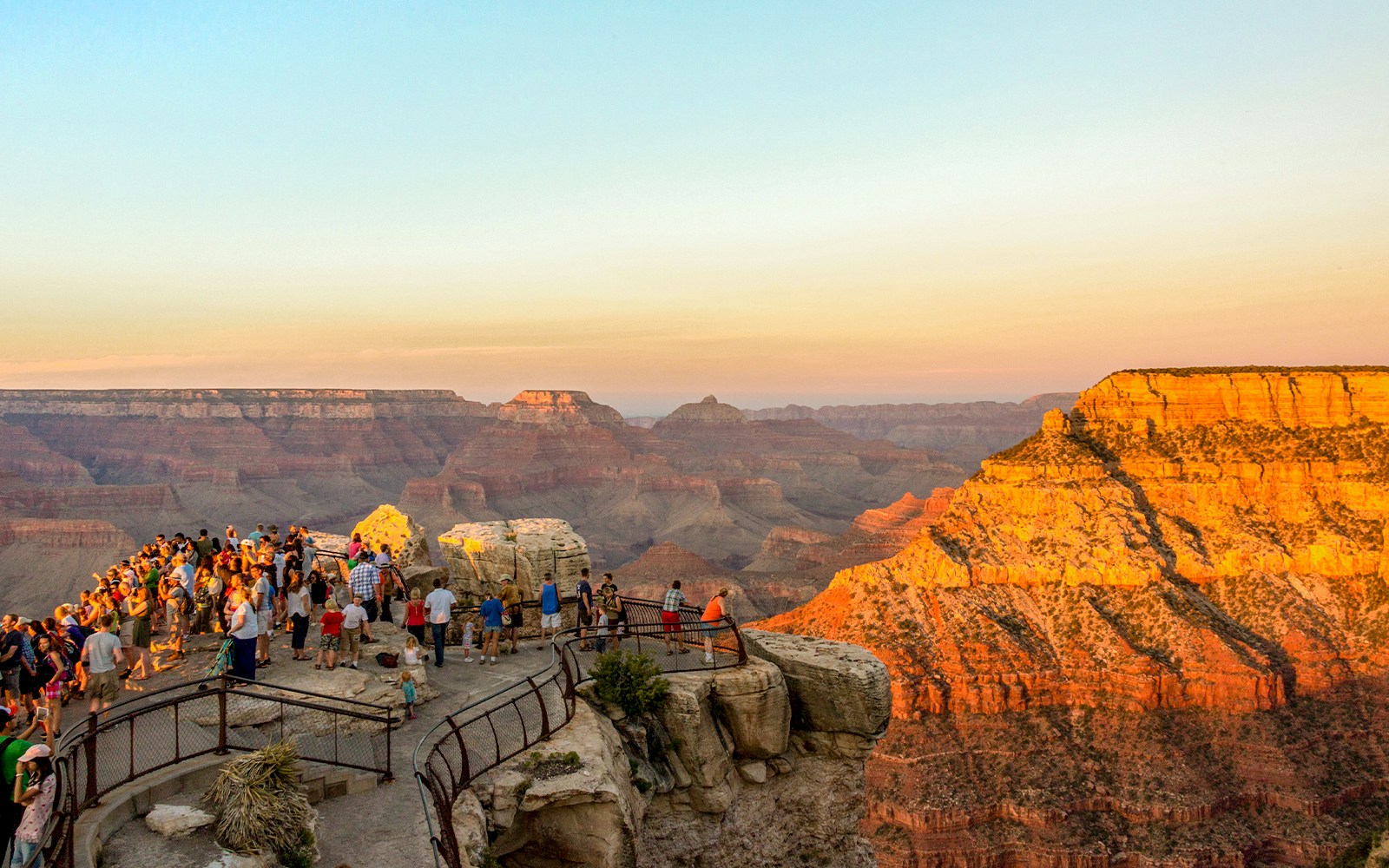 Sunset view at Mather Point, Grand Canyon, USA, highlighting the canyon's vast landscape.