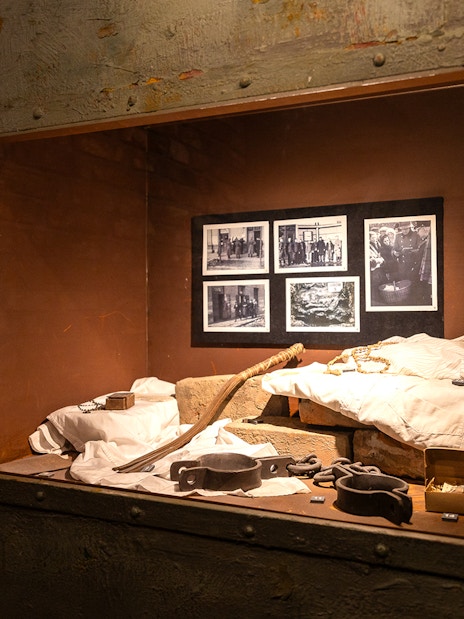 Artifacts and photos displayed inside Oskar Schindler's Factory exhibit in Krakow.