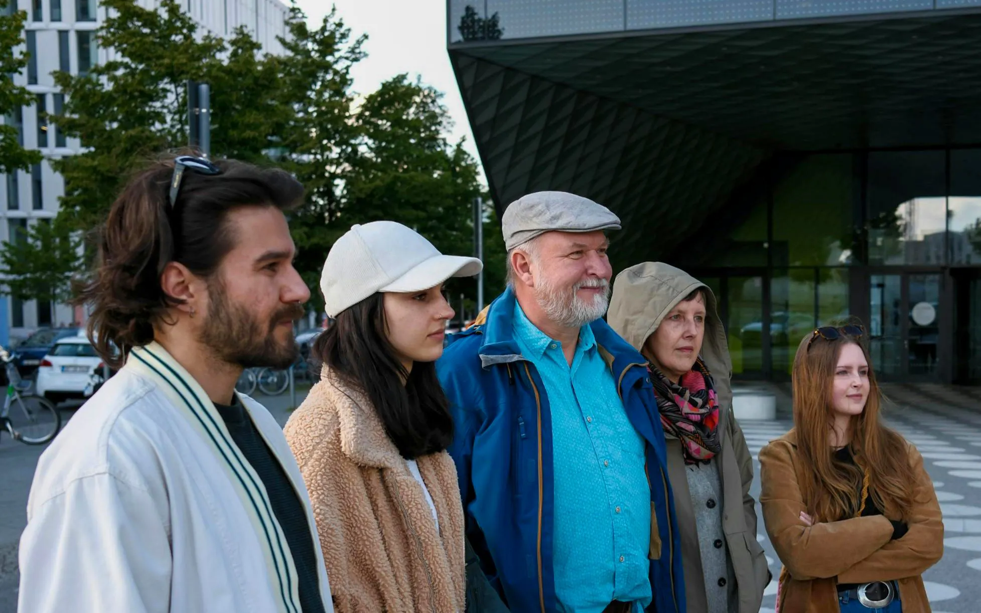 Group of tourists on a guided tour in Berlin's Government District near the Reichstag Dome.