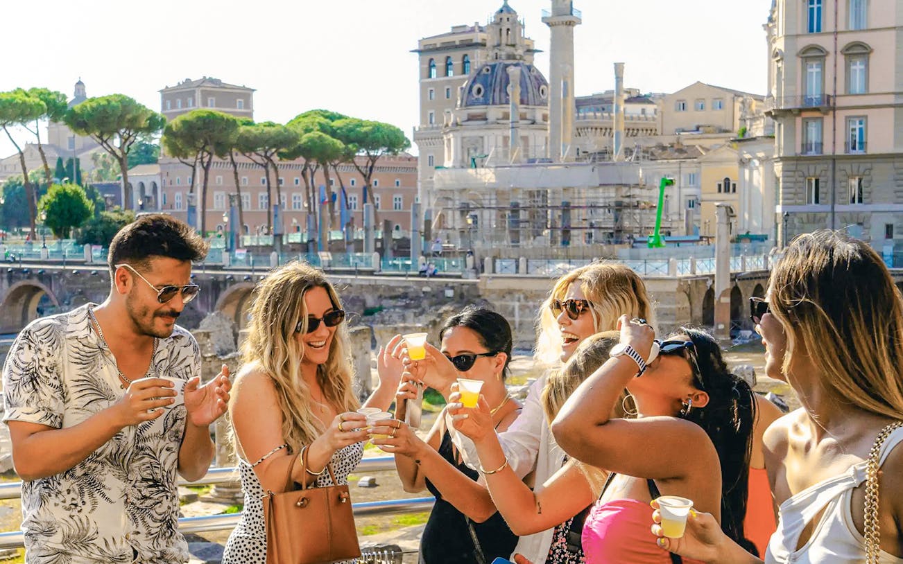 People enjoying a wine tasting experience during the Tipsy Tour in Rome, Italy.