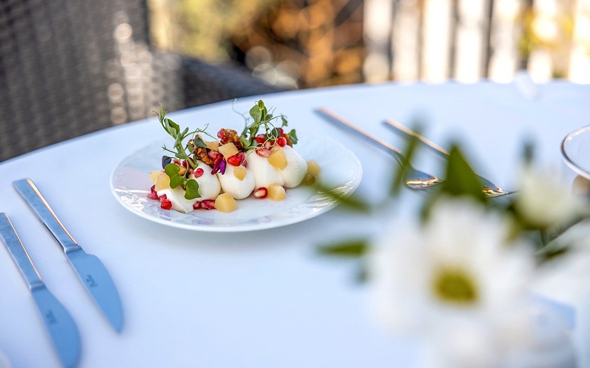 Plate of gourmet appetizers with fruit and greens served during Sky Bar Prague Aperitivo tour.