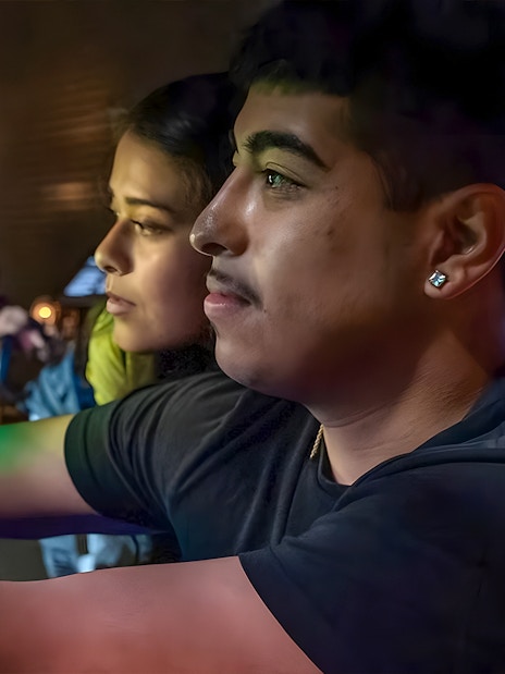 Visitors interacting with a colorful exhibit at the Exploratorium in San Francisco.