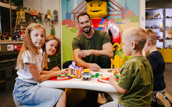 Children building with bricks at Museum of Bricks, Prague.