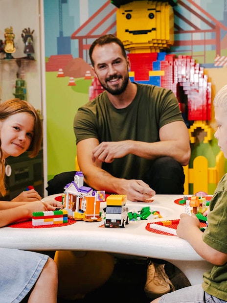 Children building with bricks at Museum of Bricks, Prague.