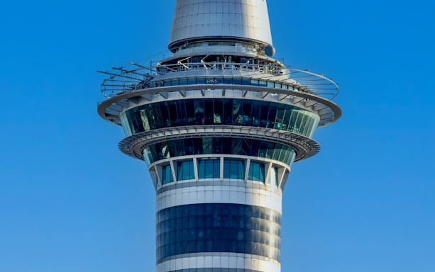 Skytower observation deck against blue sky, Auckland, New Zealand.