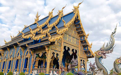 #Blue Temple with intricate gold details in Chiang Rai, part of the 2 Days / 1 Night tour from Chiang Mai.