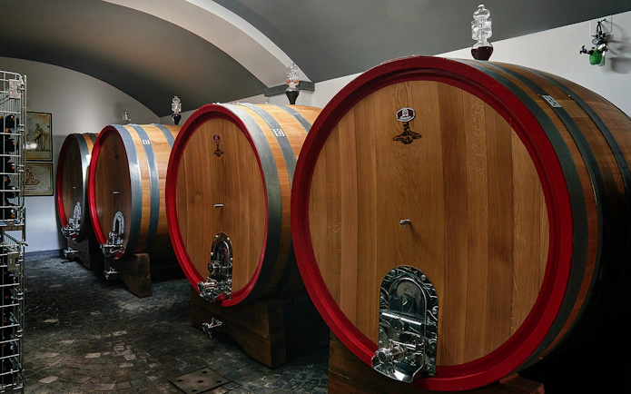 Wine barrels in a cellar on the slopes of Vesuvius, part of a Naples wine tasting tour.
