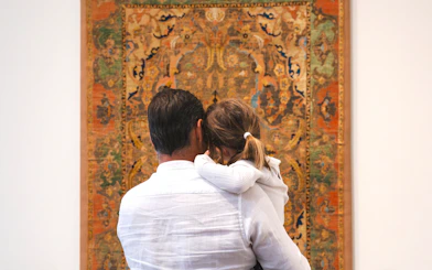 Family viewing tapestry at Louvre Abu Dhabi.