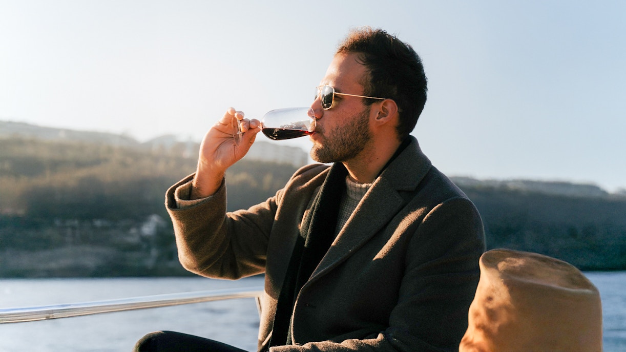 man wearing sunglasses on Douro river boat