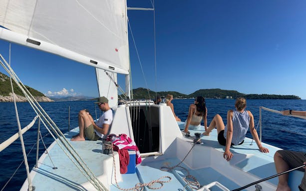 Sailing on a yacht near Elafiti Islands, Dubrovnik, with passengers enjoying the view.
