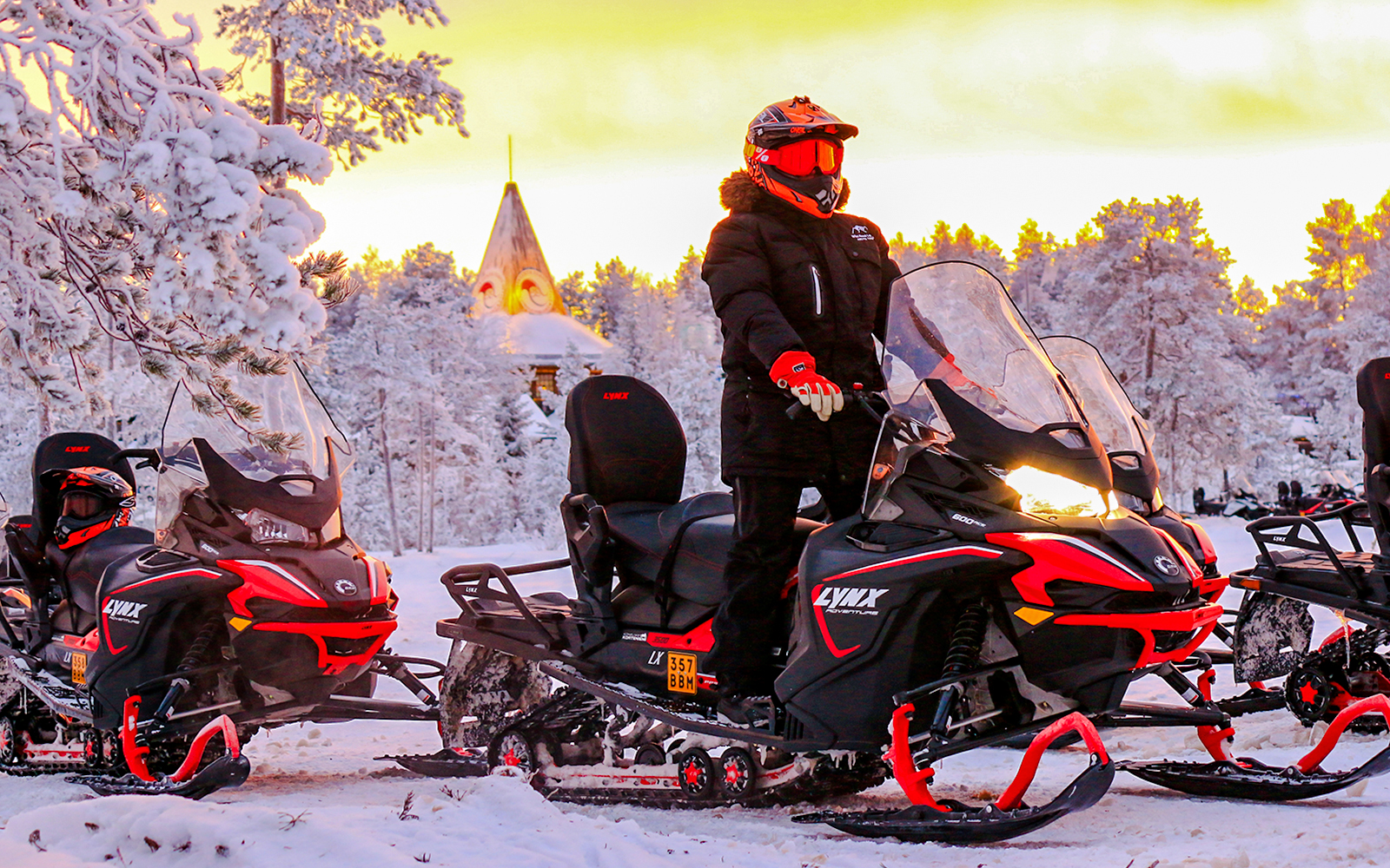 Snowmobilers on a snowy trail during 1-Hour Snowmobile Safari Adventure in Rovaniemi.