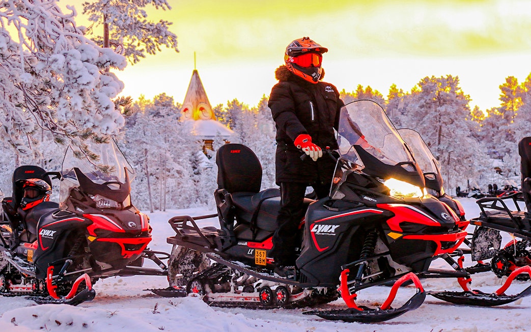 Snowmobilers on a snowy trail during 1-Hour Snowmobile Safari Adventure in Rovaniemi.