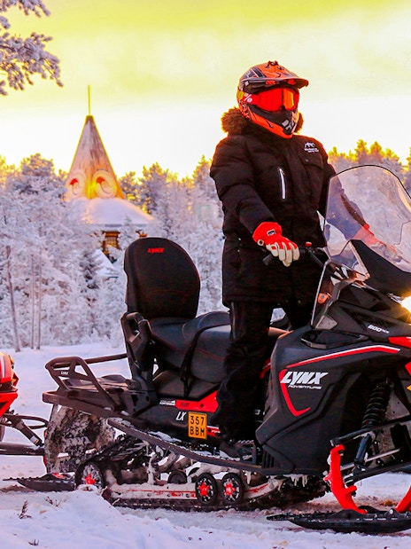 Snowmobilers on a snowy trail during 1-Hour Snowmobile Safari Adventure in Rovaniemi.