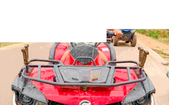 Quad bike on a dirt road during Zanzibar adventure tour.
