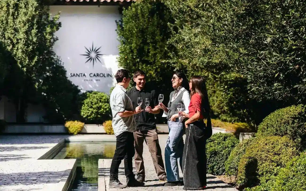 Tourists enjoying wine at Santa Carolina Winery in Santiago.