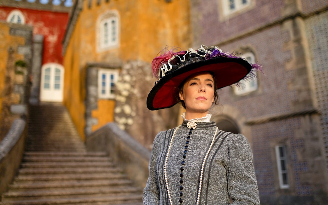 Visitor in period costume at the Palace of Pena, Sintra, Portugal.