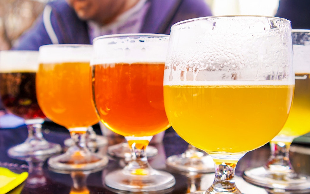Belgian beers in glasses during a tasting session in Bruges.