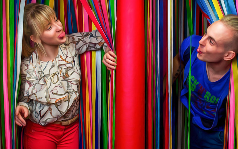 Visitors interacting with colorful ribbons at Big Fun Museum, Barcelona.