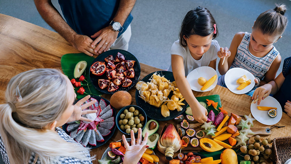 Visitors sampling exotic fruits at Tropical Fruit