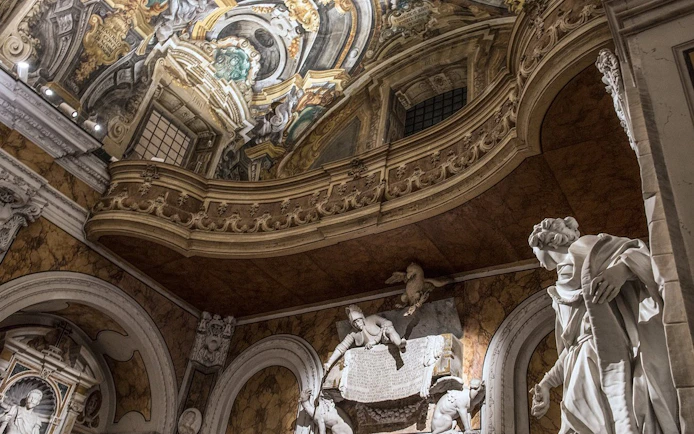 Sansevero Chapel interior with ornate ceiling and marble statues, Naples.