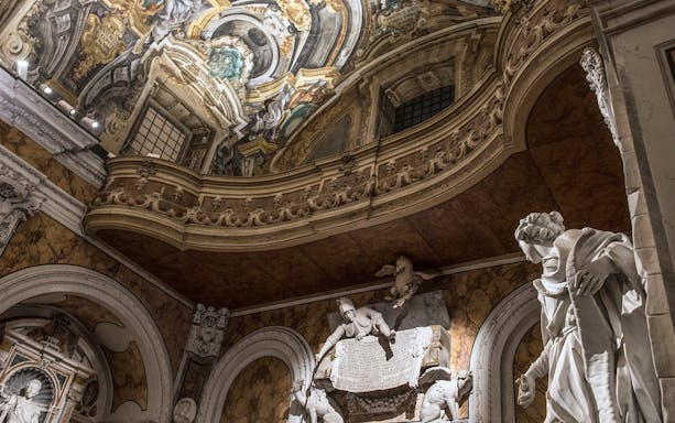 Sansevero Chapel interior with ornate ceiling and marble statues, Naples.