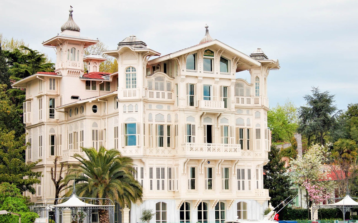 Historic wooden mansion along the Bosphorus on Istanbul sightseeing boat cruise.