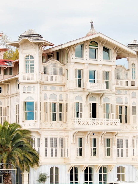Historic wooden mansion along the Bosphorus on Istanbul sightseeing boat cruise.