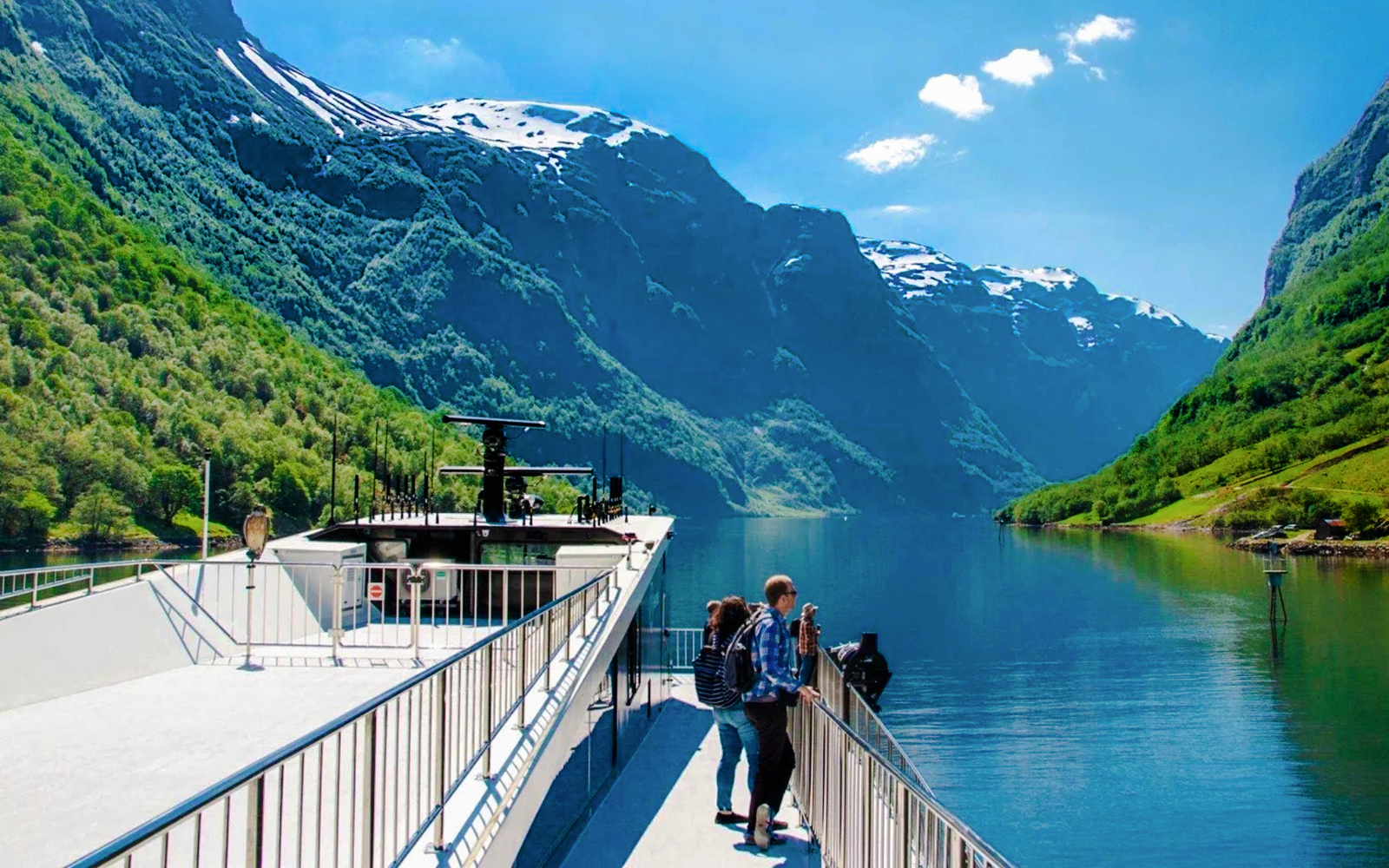 Cruise ship on Nærøyfjord with passengers enjoying views of mountains, Western Norway.