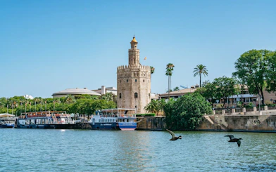 Torre del Oro viewed from Guadalquivir River cruise in Seville, Spain.