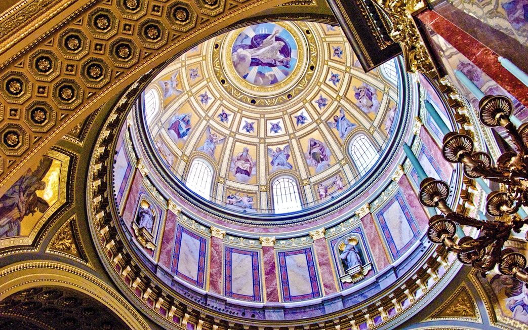 St. Stephen's Basilica interior dome with ornate frescoes and statues, Budapest.