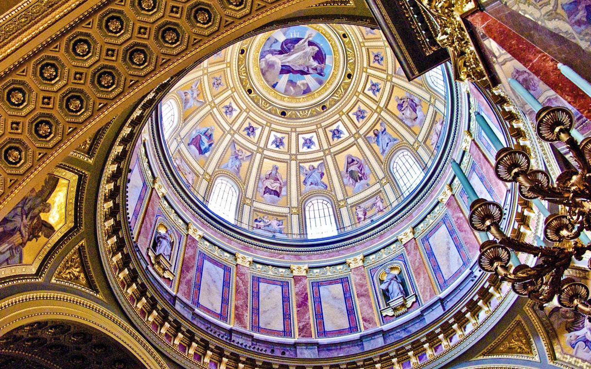 St. Stephen's Basilica interior dome with ornate frescoes and statues, Budapest.