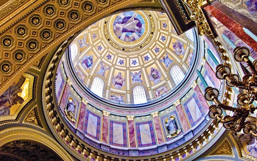 St. Stephen's Basilica interior dome with ornate frescoes and statues, Budapest.