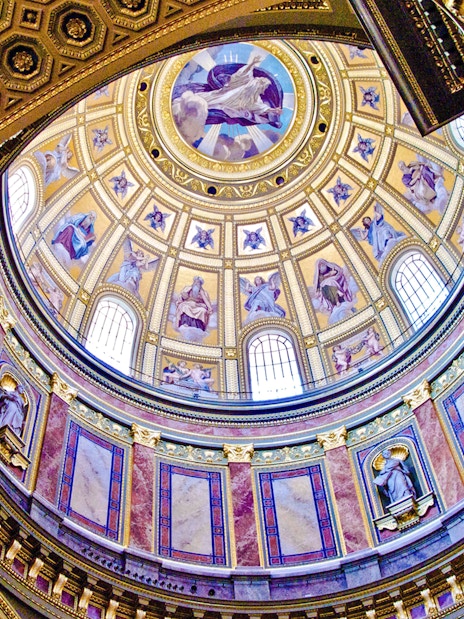 St. Stephen's Basilica interior dome with ornate frescoes and statues, Budapest.