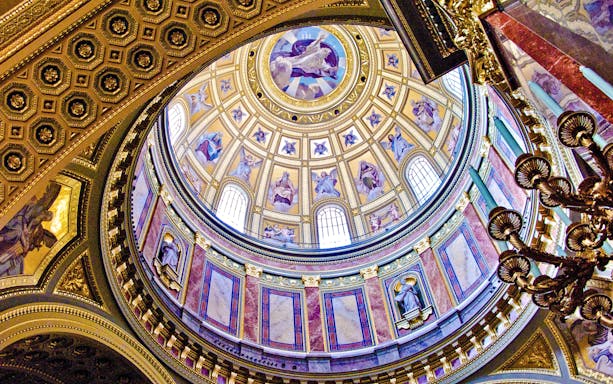 St. Stephen's Basilica interior dome with ornate frescoes and statues, Budapest.