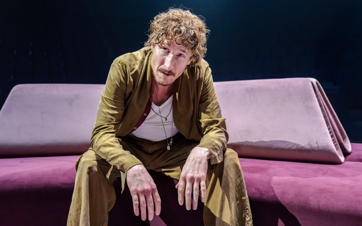 Performer on stage during Hunger Games West End show.