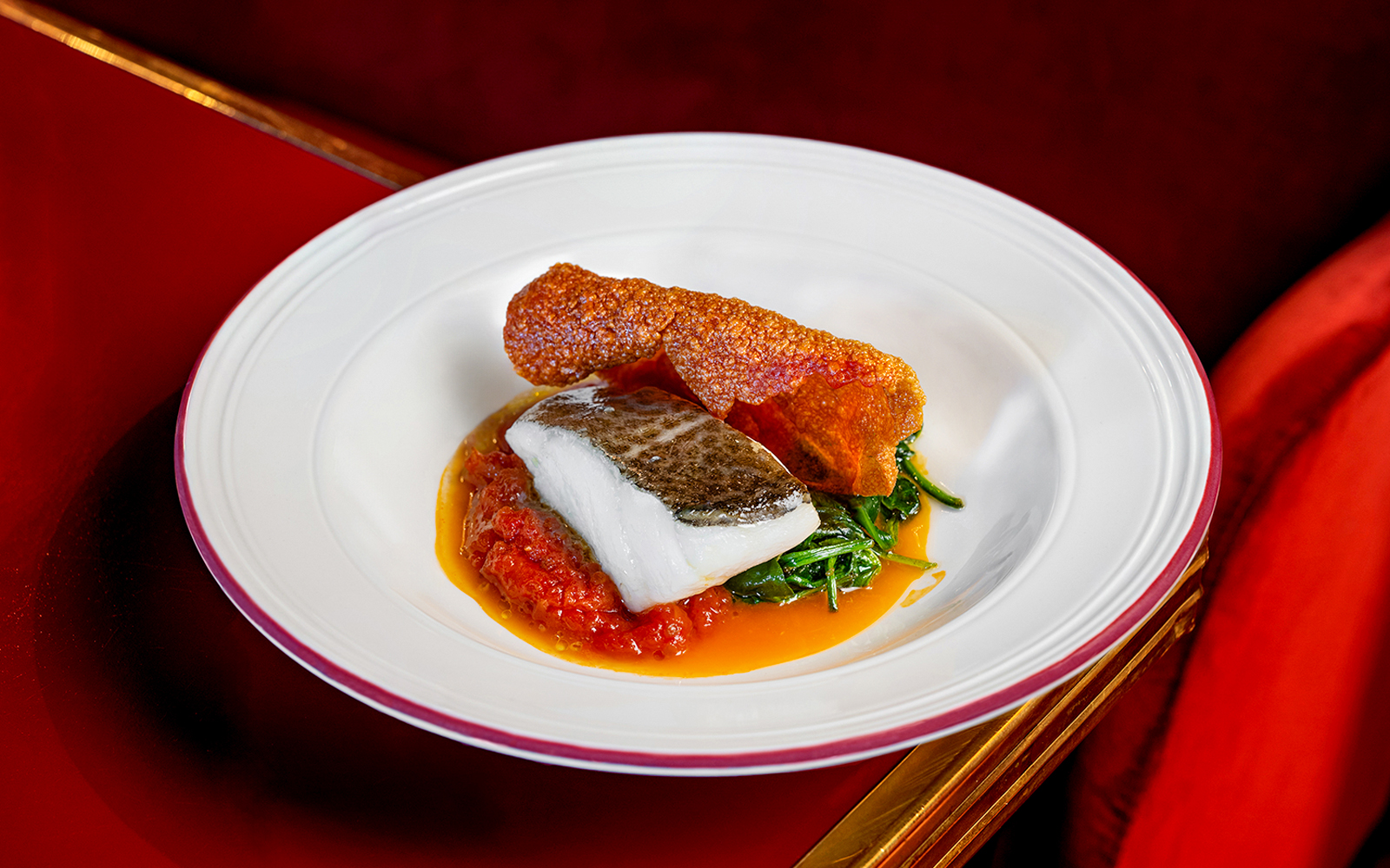 Grilled fish with crispy skin and vegetables served at Flamenco De Leones Show.