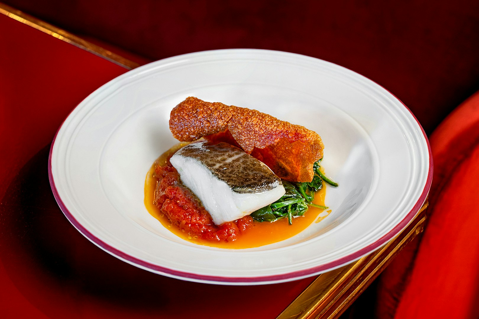Grilled fish with crispy skin and vegetables served at Flamenco De Leones Show.