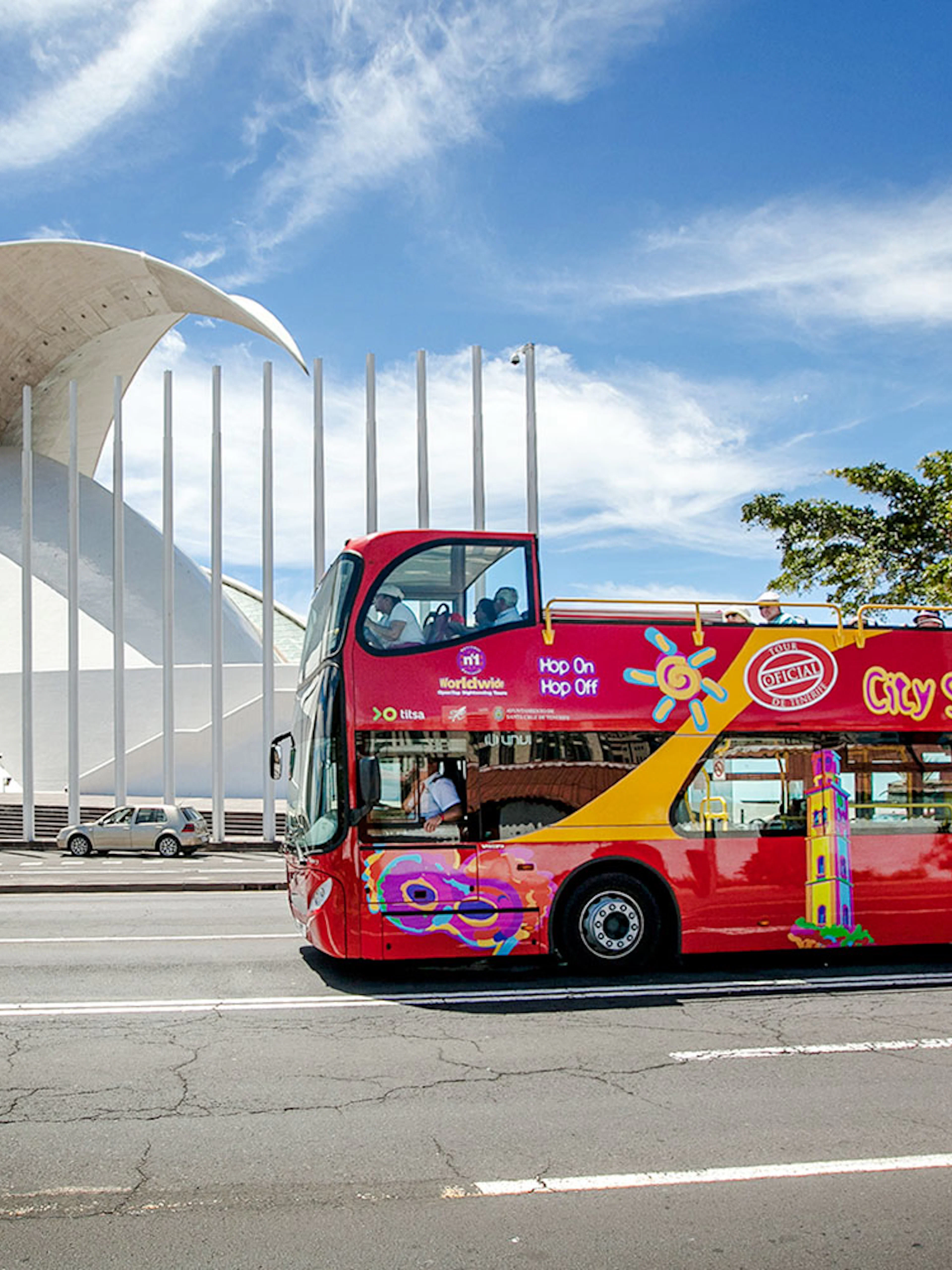Santa Cruz hop-on hop-off bus in front of Auditorio de Tenerife.