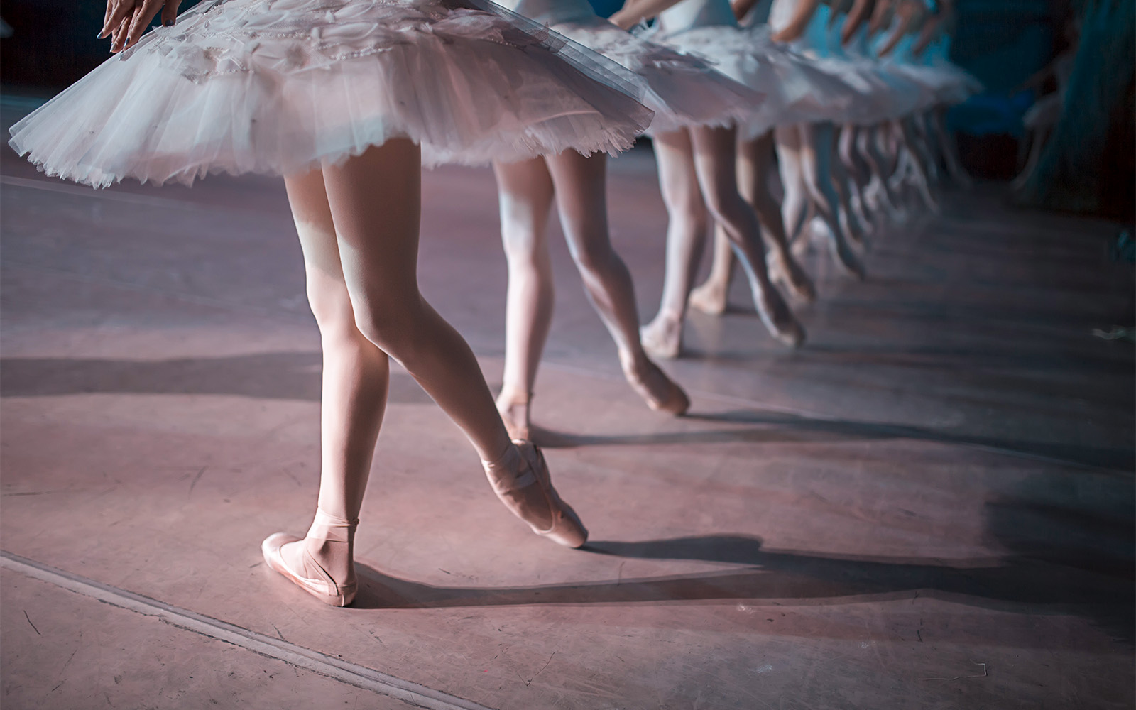 Ballet dancers performing on stage at Opera Garnier, Paris.